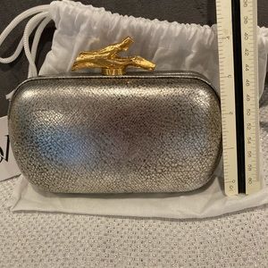 Evening small clutch. Silver with gold clasp.